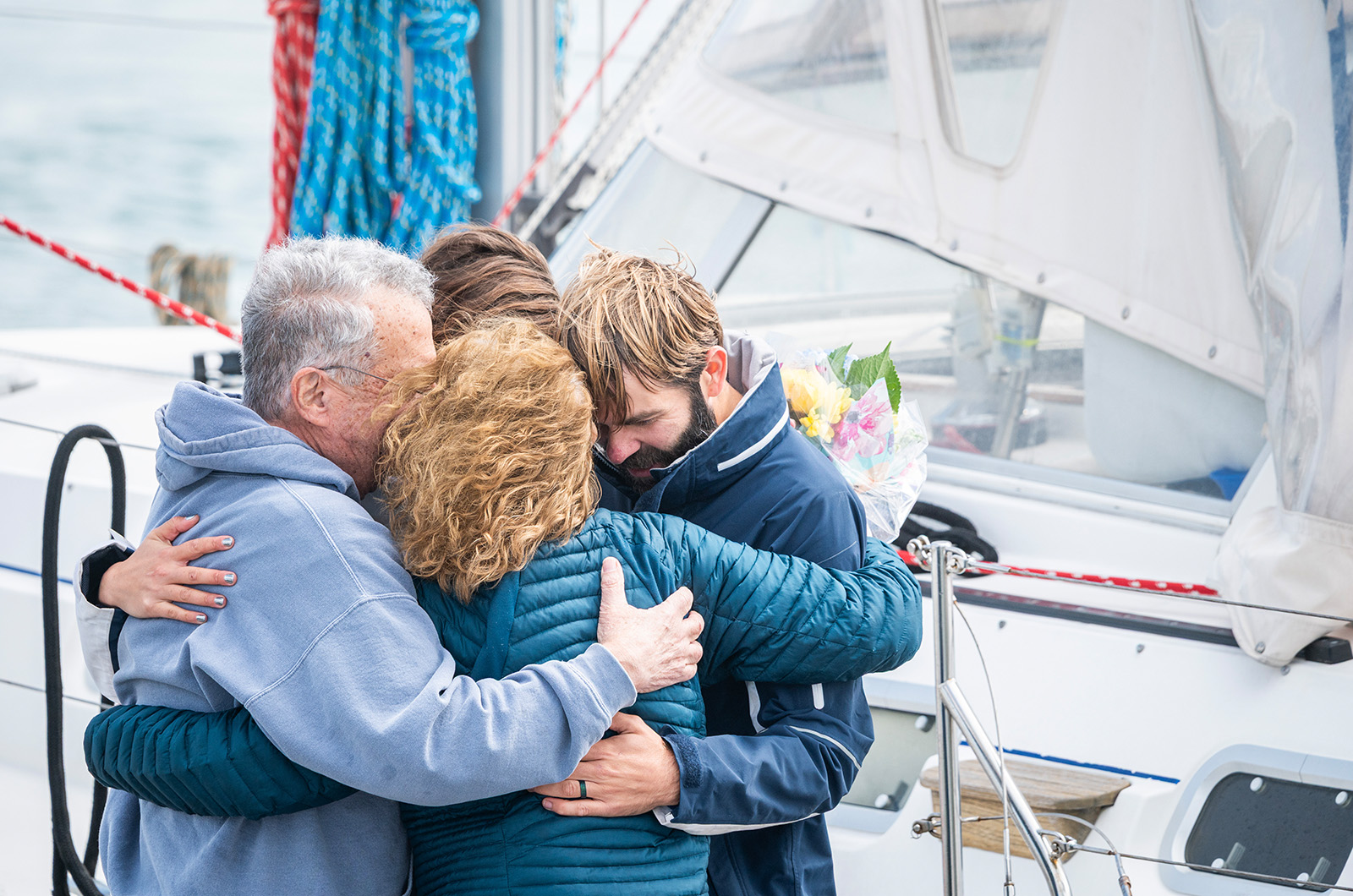A big hug from Josh's parents after a safe return following a year of sailing the Atlantic Circuit.