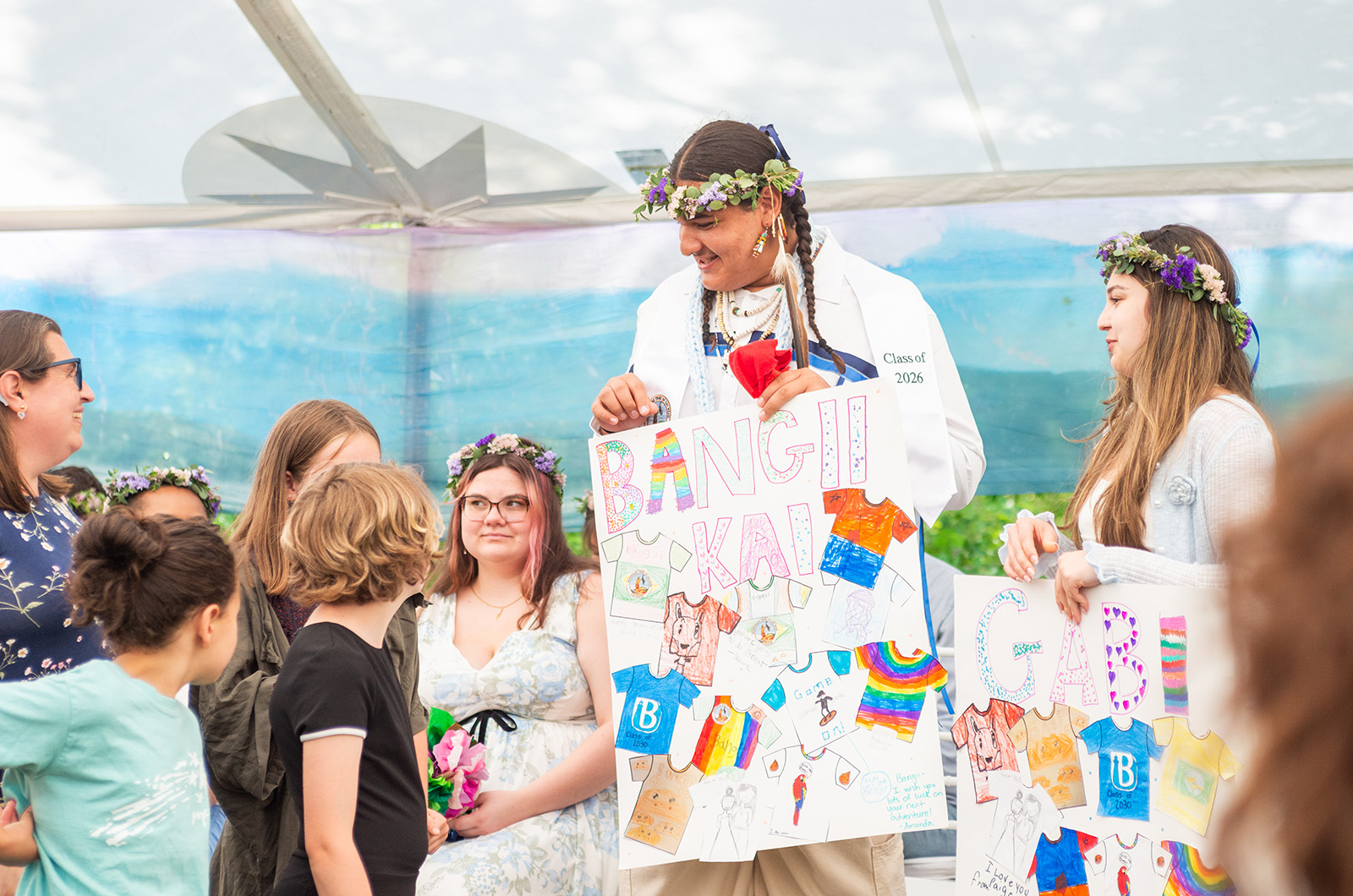 Bangii-Kai Bellecourt receives a gift from the lower grades.