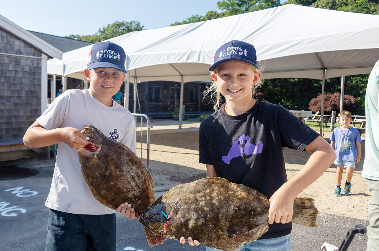 Otto Karl and Julia Kornalski with some big fluke.