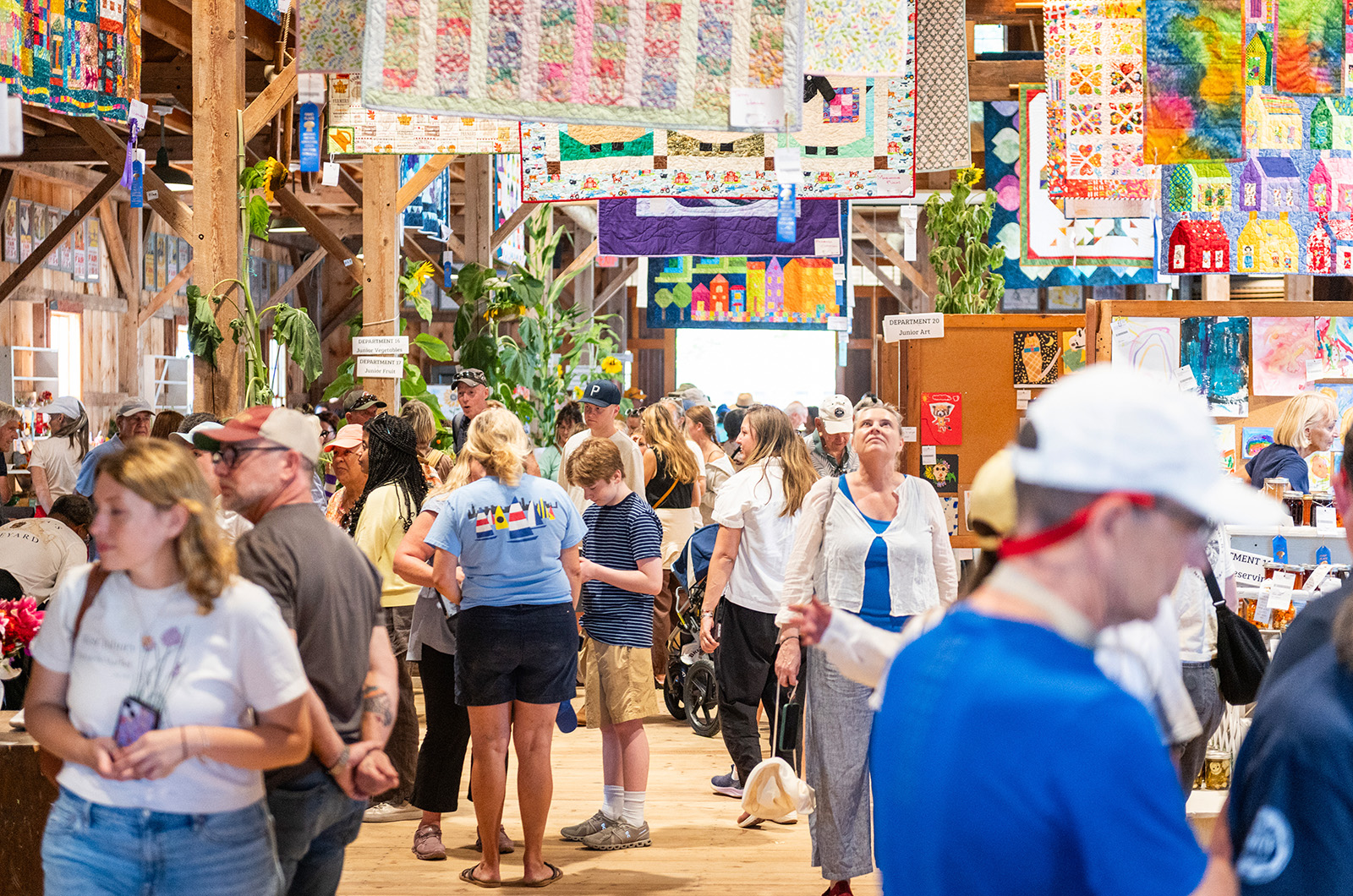 Attendees check out the wares in the Ag Hall.