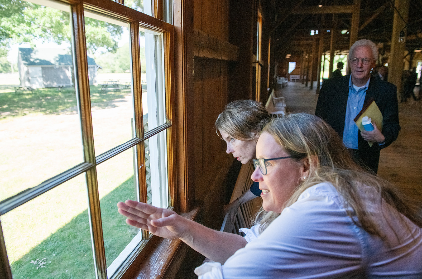 Lauren Lynch shows Gov. Maura Healey the Ag Society grounds.