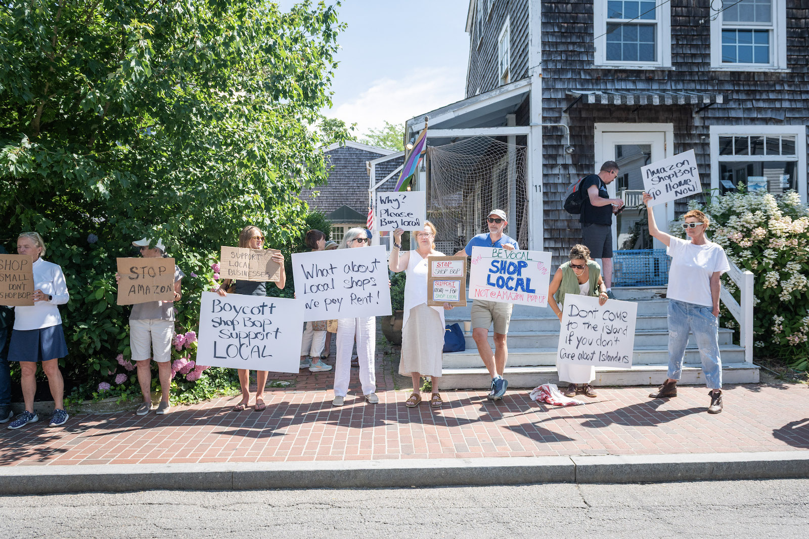 A group of protestors forms along Winter street.