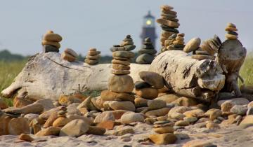 stone beach cairns lighthouse