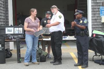 EMT Kristina West, pictured here with Tri-Town ambulance chief Zeke Wilkins and Aquinnah police chief Randhi Belain, was honored for her role in saving the life of Christopher McCloud. 