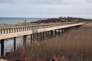 After revetment is removed, 2,600 tons of sand dredged from Menemsha Channel will be placed in the parking lot to create a sand dune.