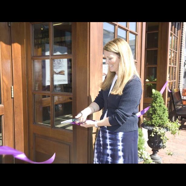 cuts ribbon.
