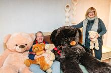 [l-r] Win Baker, and Wendy Harman in their favorite place...a pile of teddy bears.