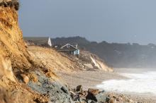 Houses along the edge of Stonewall Beach in Chilmark hang precariously close to the edge.