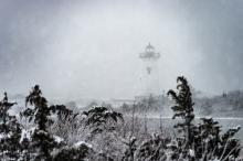Edgartown Light House is obscured by white-out conditions.