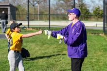 Coach Drew Kelly gives some encouragement to Cruz Cancellare.