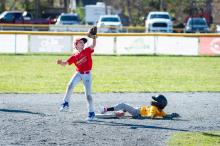 Cole Metell reaches for the ball as Jason Kornalski goes into a slide.