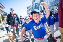 All smiles for Robbie Moriarty at opening day Little League parade up Circuit avenue.