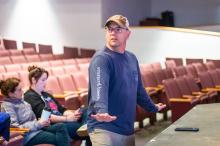 Ken Romero demonstrates choreography.