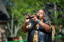 Carole Vandall gives thanks and plays the flute.