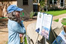 Pam Glavin reads all the information on her late husband Carl Widdis.
