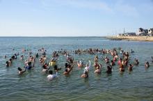 Swimmers join in on some calisthenics.