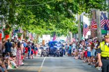 The parade makes its way up Main street.