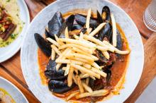 Mussels puttanesca with truffle fries at 9 Craft.