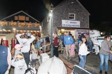 Participants line up on Saturday night to weigh in Albies.