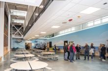 The walkway spans over the cafeteria.