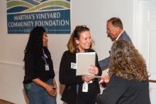 Leah Palmer of CAP receives a grant.