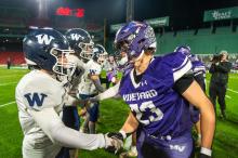 Captains shake hands at the start.