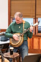 A banjo and a pint of Guinness make for a grand time.