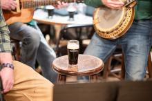 The band lets a pint sit in for a number.