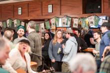 St. Patrick's Day revelers enjoy a drink at the bar.