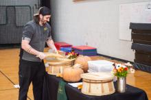 Morning Glory Farm head chef Gus Paquette-Whall prepares his booth.