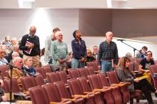 Voters line up to discuss the ADU bylaw.