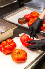 Cutting heirloom tomatoes from Morning Glory farm.