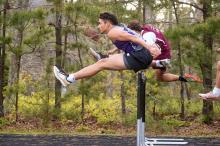 Leaping over hurdles.