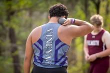 A track and field athlete warms up for the shot-put.
