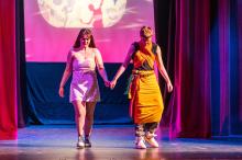 Josephine Powers and Jason Jarrell walk out on the runway.