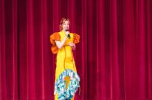 Art teacher Tiffiney Shoquist introduces. the student fashion show.