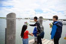 Throwing flowers into Vineyard Haven harbor.