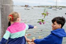 Throwing flowers into Vineyard Haven harbor.