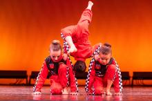 Dancers support each other.