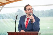 Comedian Charlie Nadler warms up the crowd.