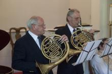 Frank and Peter Dunkl play French horn part of the musical prelude.