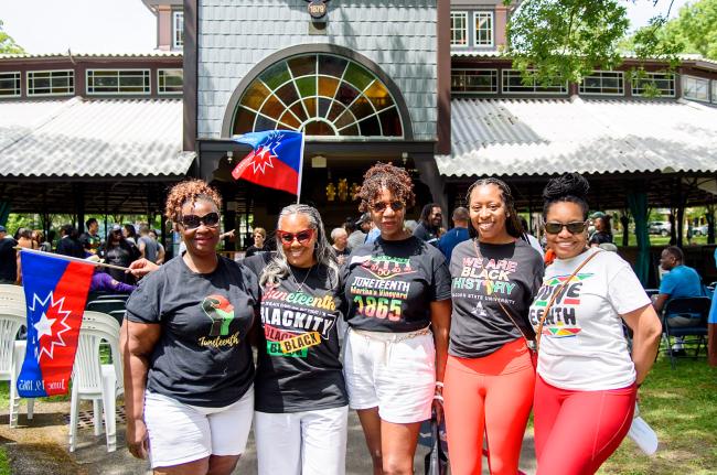 Friends gather for the Juneteenth flag raising.