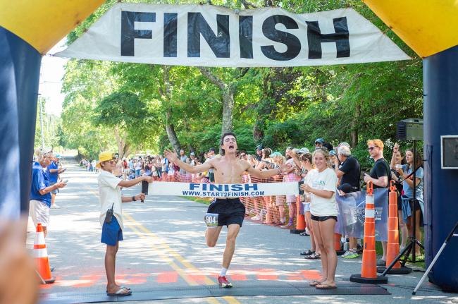 Jack Lionette crosses the finish line first with a time of 15:51.52.