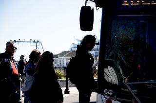 Passengers board a bus at the Steamship Authority terminal in Vineyard Haven.