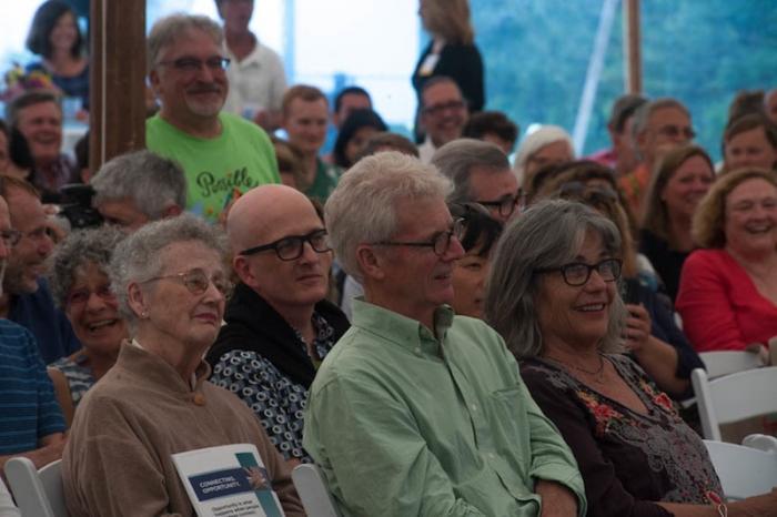 Norman Bridwell's wife Norma Bridwell and son Tim Bridwell, seated behind Allen and Lynne Whiting.
