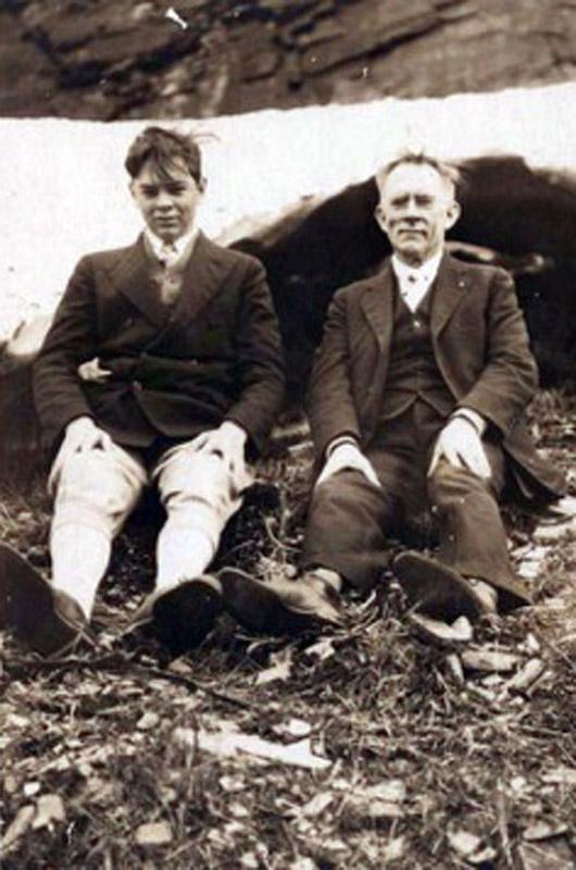 Donald Vose, future president of Edgartown National Bank, with his grandfather Julien W. Vose, who shot this film, sitting on a glacier in 1931.