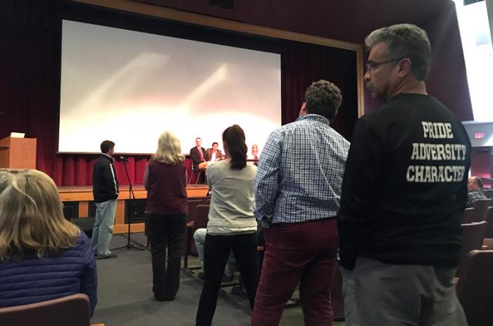 Supporters and critics lined up to voice opinions at school committee meeting Monday.