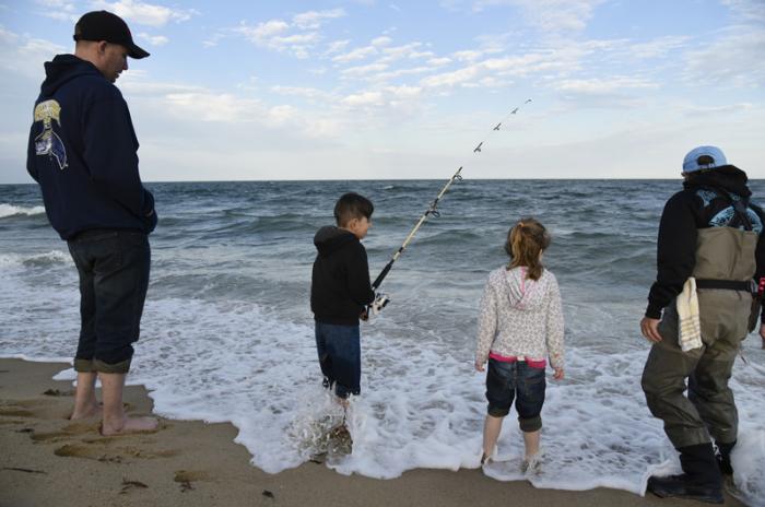 Cpl. Michael Mack, Marine Corps, with son Aiden and daughter Illithyia. Janet Messineo (right) helps out.