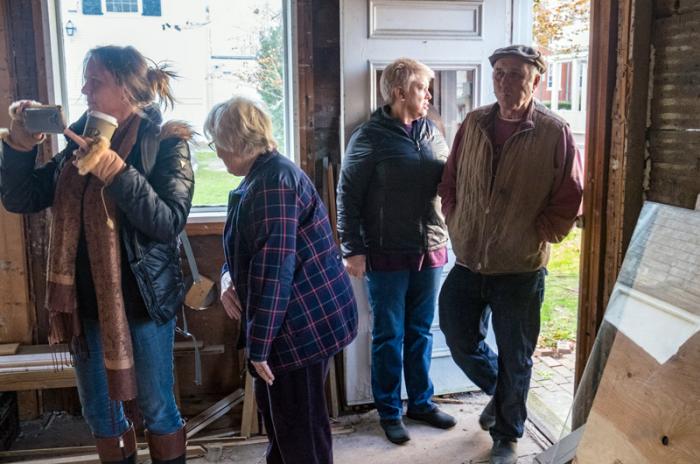 Eugene Courtney (wearing cap), a well-known downtown business owner, is among 14 people who have expressed interest in the property.
