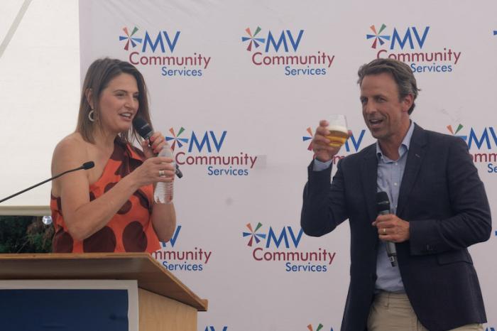 Host Sherry Truhlar and Seth Meyers try to stay hydrated on hot evening.